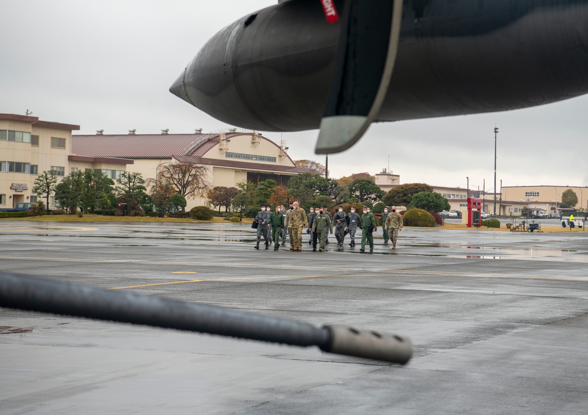 Members of the Japan Air Self-Defense Force Air Defense Command approach an AC-130J Ghostrider, assigned to Cannon Air Force Base’s 17th Special Operations Squadron, during Keen Sword 23, at Yokota Air Base, Japan, Nov. 15, 2022.