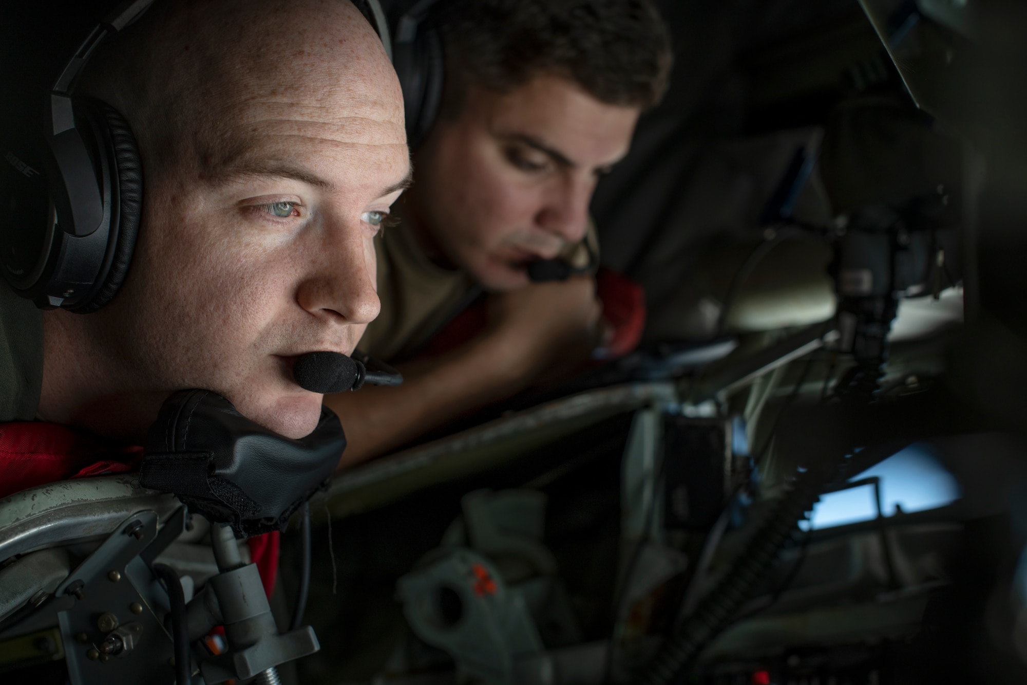 U.S. Air Force SSgt. Andrew Chase, 909th ARS boom operator, delivers fuel to an F-15C Eagle during a flight over the Pacific Ocean in support of exercise Keen Sword 23, Nov. 17, 2022. Bilateral exercises allow U.S. military and Japan Self-Defense Forces to work together across a variety of areas to enhance interoperability and readiness. (U.S. Air Force photo by Senior Airman Jessi Roth)