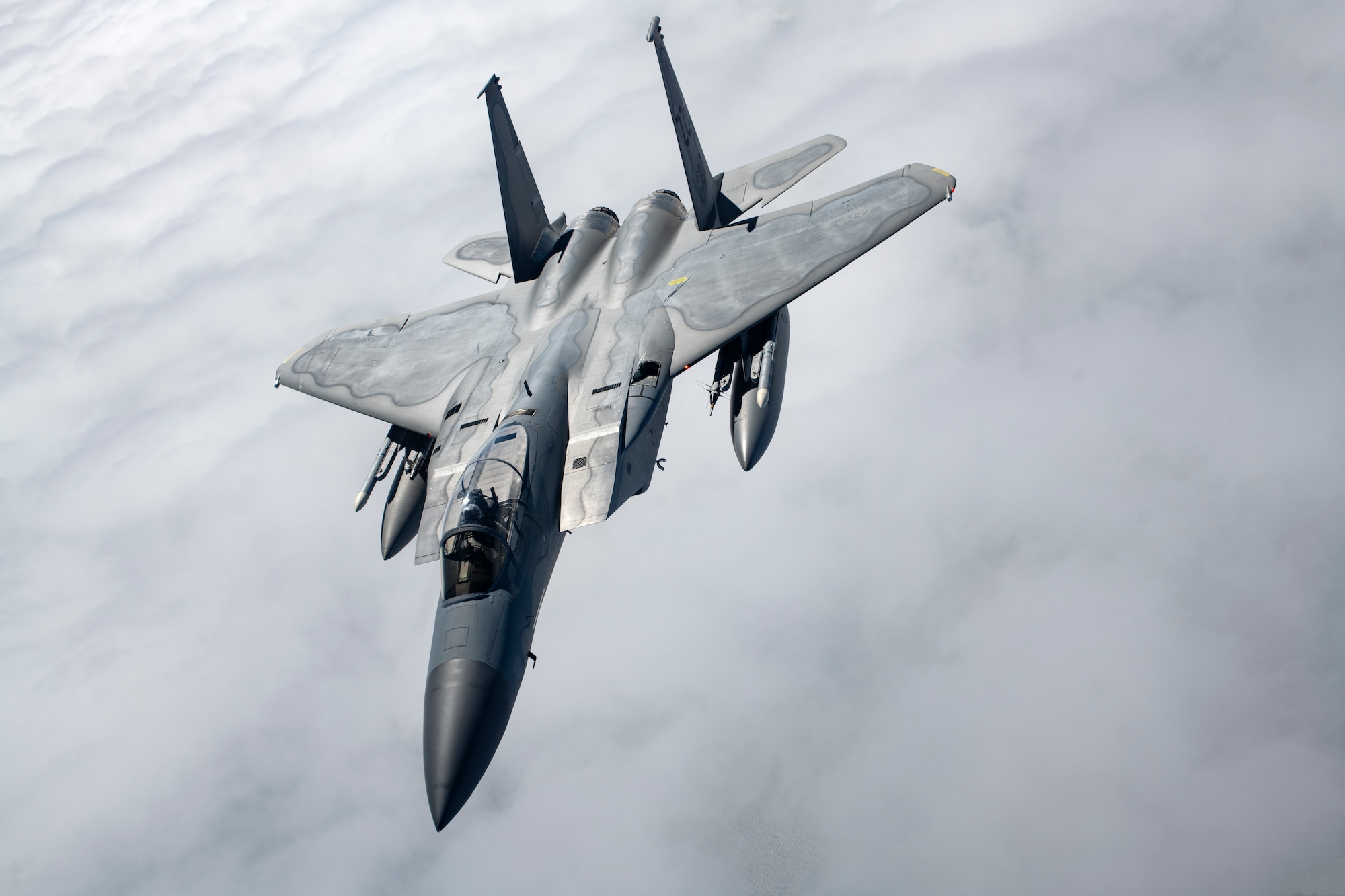 A 44th Fighter Squadron F-15C Eagle departs after receiving fuel from a 909th Air Refueling Squadron KC-135 Stratotanker during a flight over the Pacific Ocean in support of exercise Keen Sword 23, Nov. 17, 2022. Bilateral exercises allow U.S. military and Japan Self-Defense Forces to work together across a variety of areas to enhance interoperability and readiness. (U.S. Air Force photo by Senior Airman Jessi Roth)