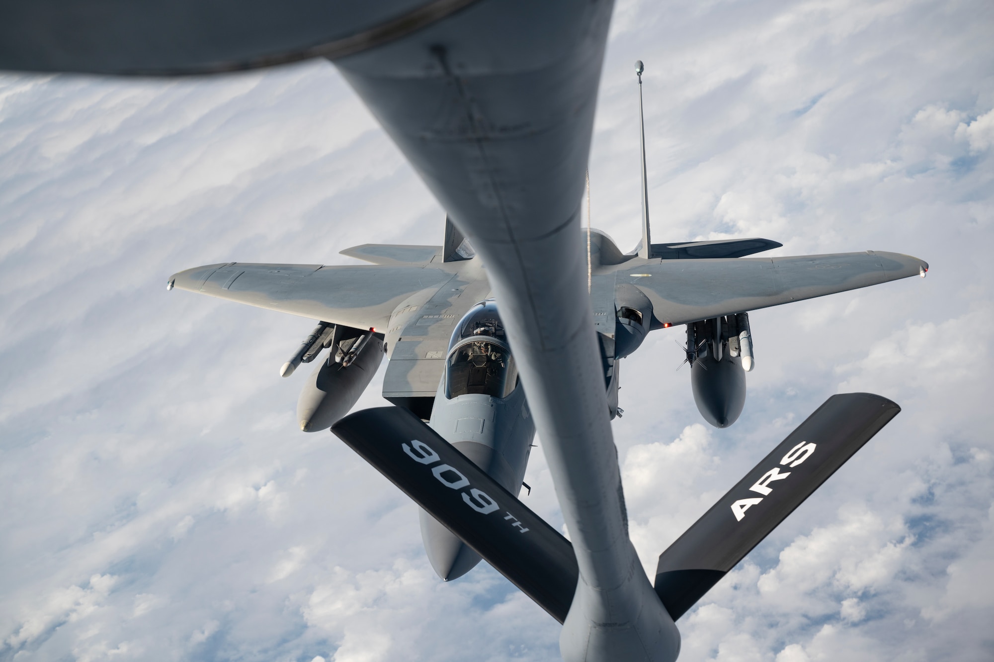 A 44th Fighter Squadron F-15C Eagle approaches a 909th Air Refueling Squadron KC-135 Stratotanker to receive aerial refueling during a flight over the Pacific Ocean in support of exercise Keen Sword 23, Nov. 17, 2022. Bilateral exercises allow U.S. military and Japan Self-Defense Forces to work together across a variety of areas to enhance interoperability and readiness. (U.S. Air Force photo by Senior Airman Jessi Roth)
