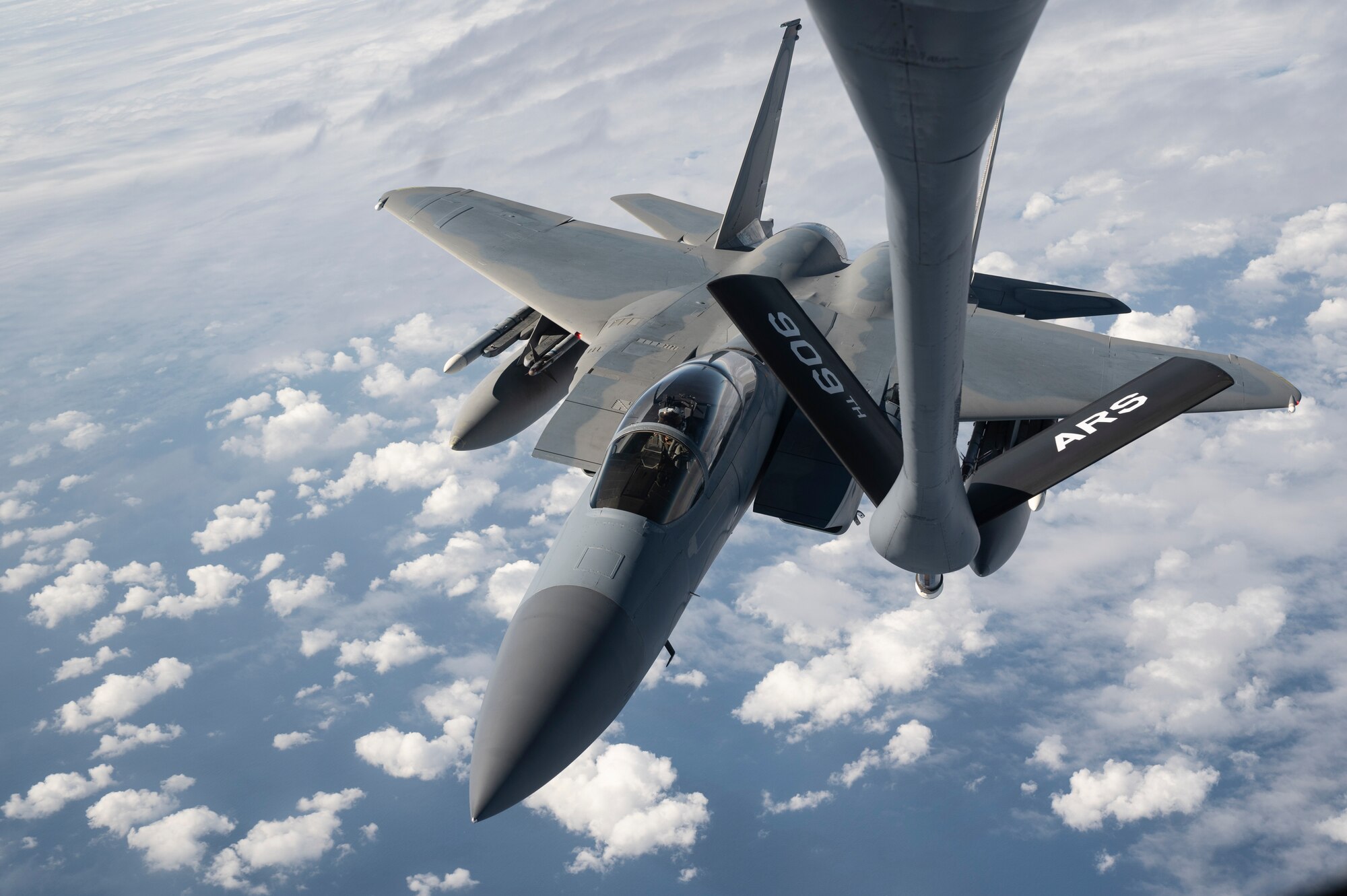 A 44th Fighter Squadron F-15C Eagle approaches a 909th Air Refueling Squadron KC-135 Stratotanker to receive aerial refueling during a flight over the Pacific Ocean in support of exercise Keen Sword 23, Nov. 17, 2022. Joint and bilateral cooperation and collaboration enhance regional security, stability, and prosperity. (U.S. Air Force photo by Senior Airman Jessi Roth)