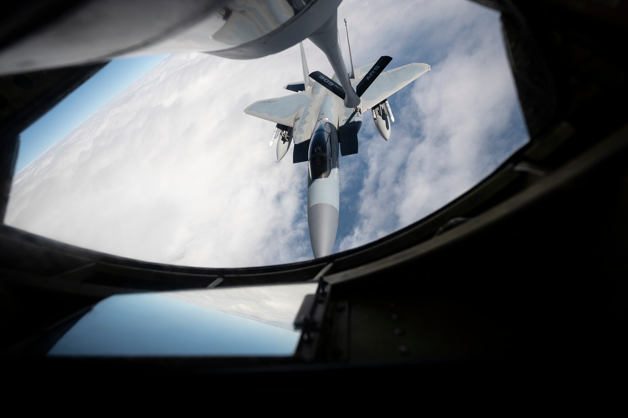 A 44th Fighter Squadron F-15C Eagle receives fuel from a 909th Air Refueling Squadron KC-135 Stratotanker during a flight over the Pacific Ocean in support of exercise Keen Sword 23, Nov. 17, 2022. Joint and bilateral cooperation and collaboration enhance regional security, stability, and prosperity. (U.S. Air Force photo by Senior Airman Jessi Roth)
