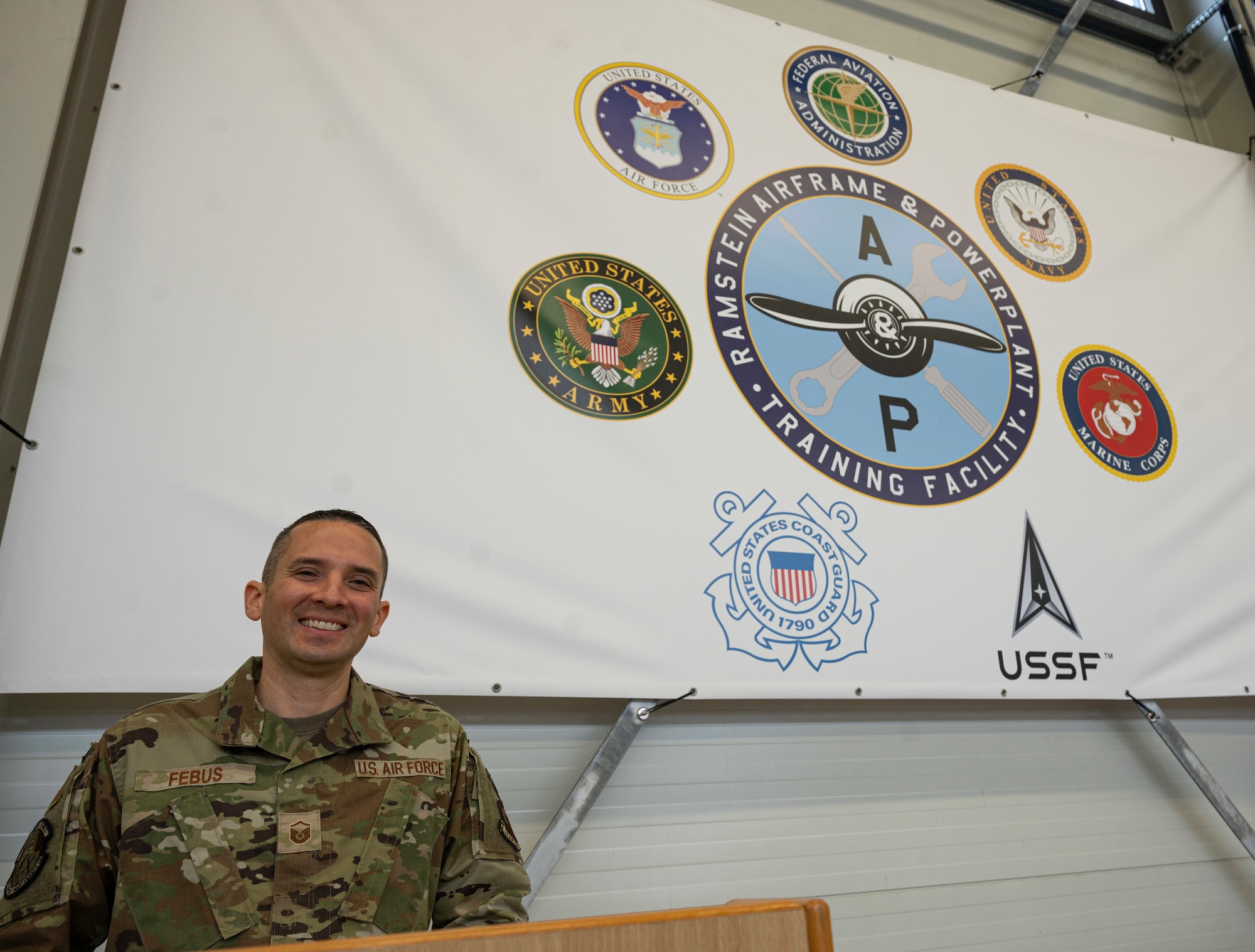 U.S. Air Force Master Sgt. Jaime Febus, 86th Maintenance Group Airframe and Powerplant program manager, poses for a photo at the Ramstein Airframe and Powerplant Facility at Ramstein Air Base, Germany, Nov. 16, 2022. Febus partnered with the Federal Aviation Administration to open the facility because of his desire to help those in the Ramstein maintenance community. (U.S. Air Force photo by Senior Airman Thomas Karol)