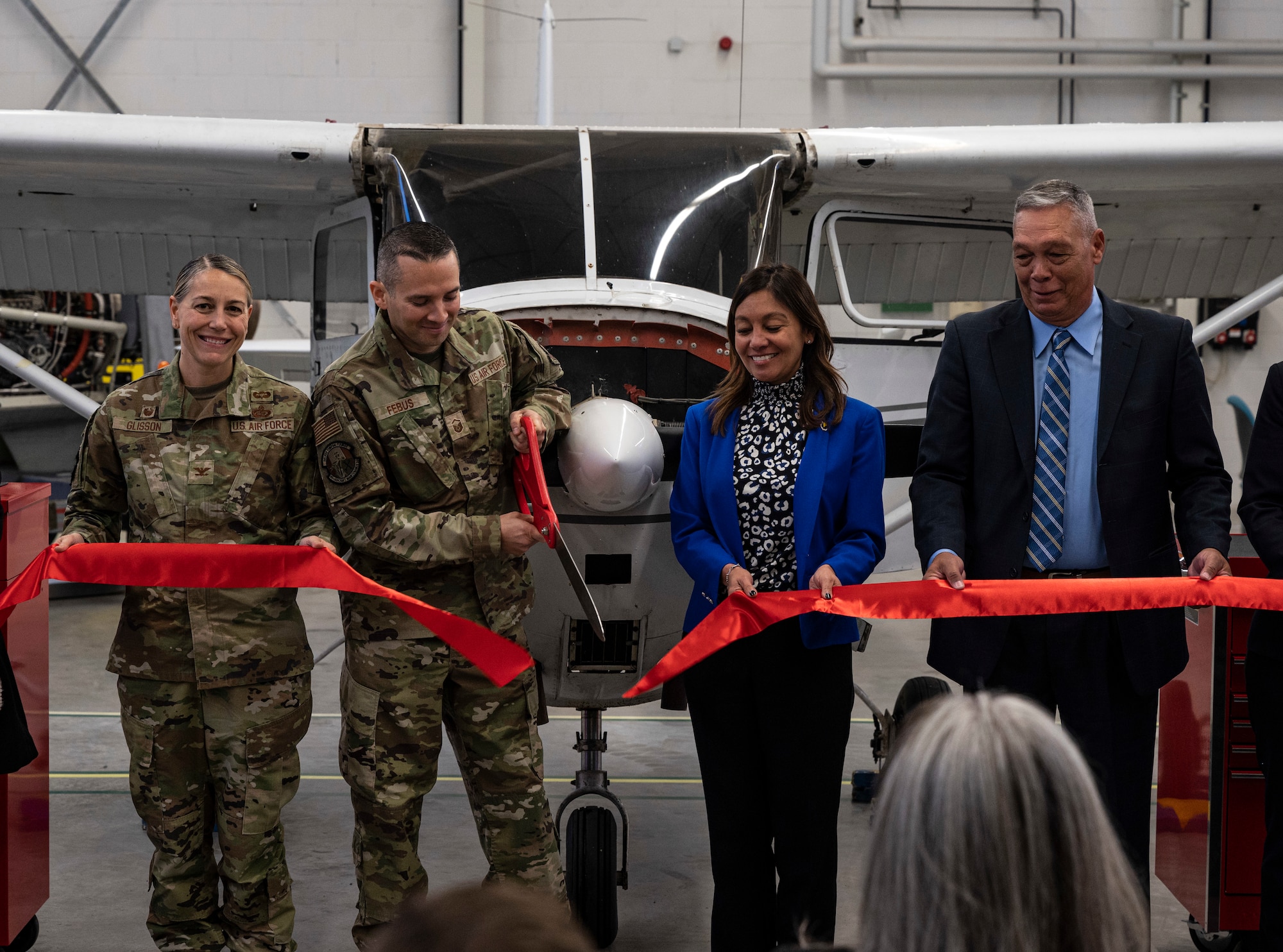 Leaders from Ramstein Air Base, Germany and the Federal Aviation Administration cut a ribbon at the Ramstein Airframe and Powerplant Facility at RAB, Nov. 16, 2022. This facility is the only one of its kind outside of the U.S. allowing service members to obtain the Airframe and Powerplant certificate. (U.S. Air Force photo by Senior Airman Thomas Karol)