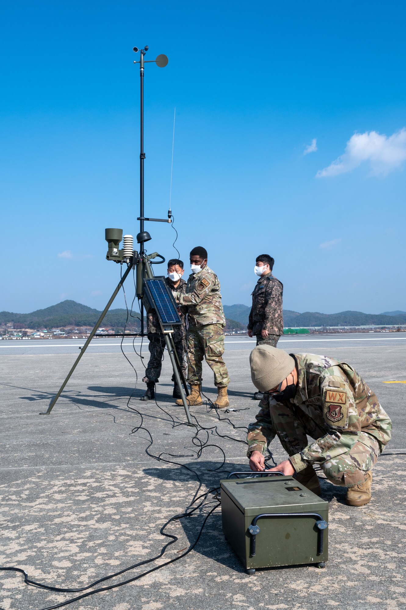 U.S. Air Force Airmen from the 51st Operational Support Squadron and Republic of Korea Airmen set up a TMQ-53 tactical meteorological observing system during a combined training event involving USAF and ROKAF partners