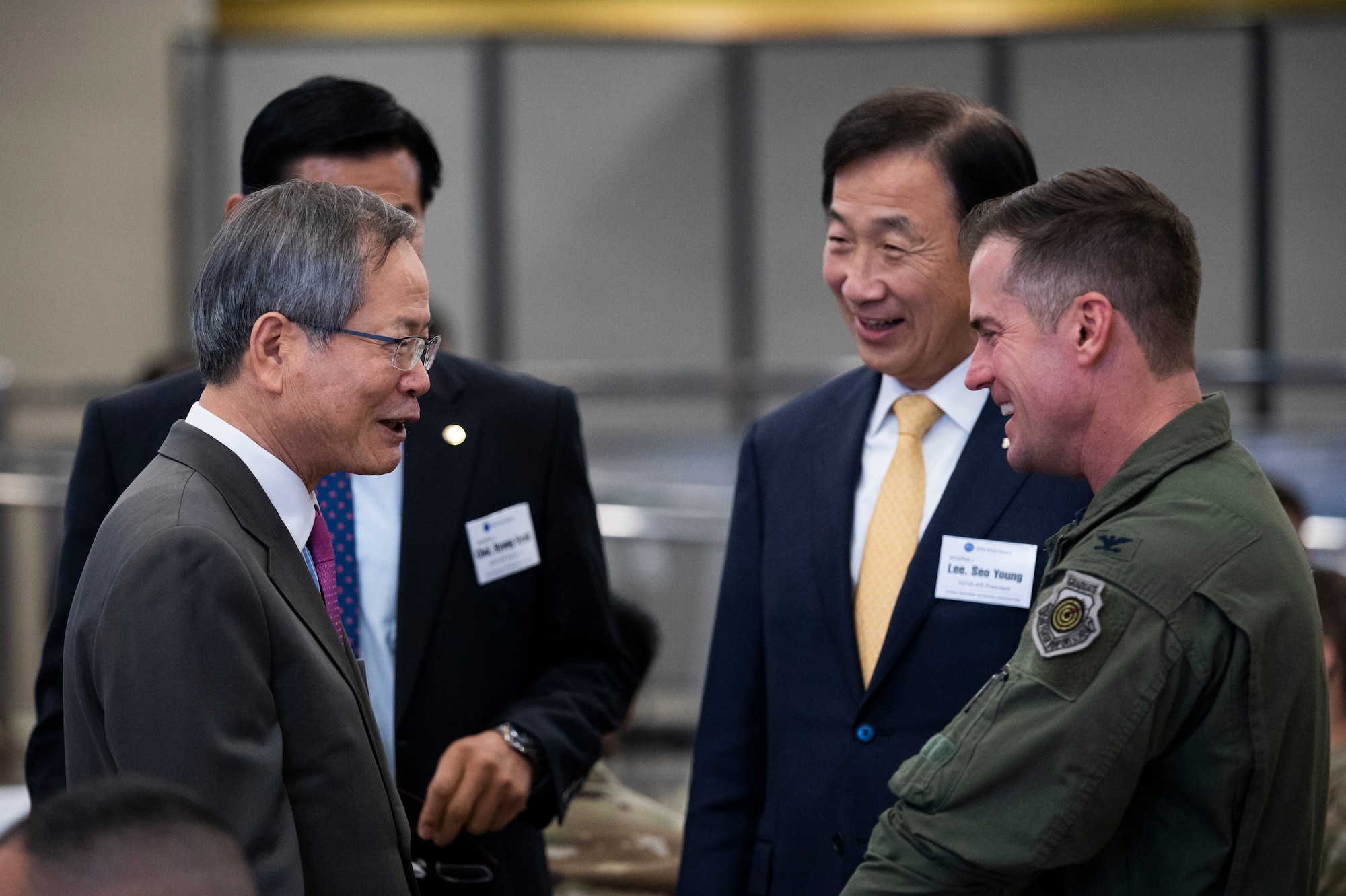 Keynote Speaker Yungwoo Chun, former Republic of Korea Ambassador to the UK, left, met with U.S. Air Force Col. Joshua Wood, 51st Fighter Wing commander, right, during the Korean Defense Veterans Association Alliance Education Conference at Osan Air Base, Republic of Korea, Nov. 18, 2022.