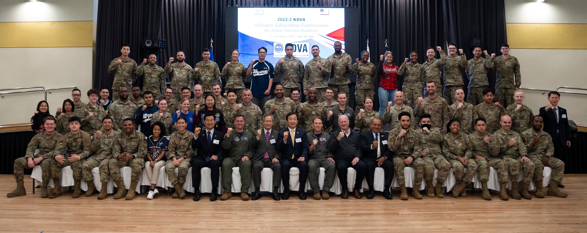 Korean Defense Veterans Association Alliance Education Conference participants gather for a group photo at Osan Air Base, Republic of Korea Nov. 18, 2022.