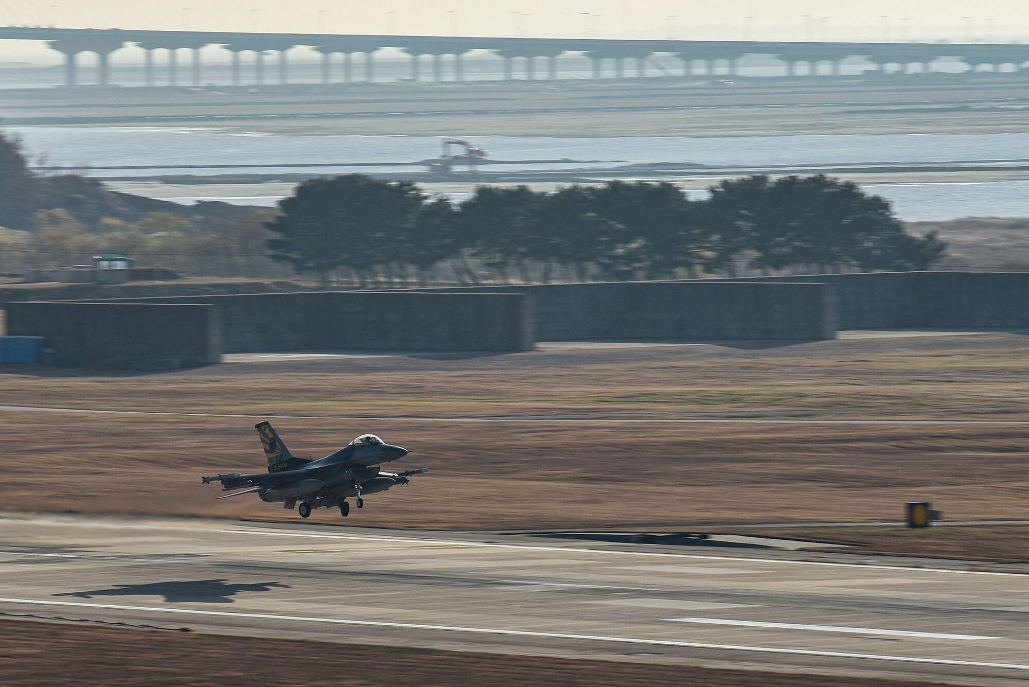 An F-16 Fighting Falcon assigned to the 80th Fighter Squadron takes off from the flightline at Kunsan Air Base, Republic of Korea, Nov. 18, 2022. The 80th Fighter Squadrons executes air combat operations in support of U.S. and ROK interests in the Pacific area of responsibility. (U.S. Air Force photo by Tech. Sgt. Timothy Dischinat)