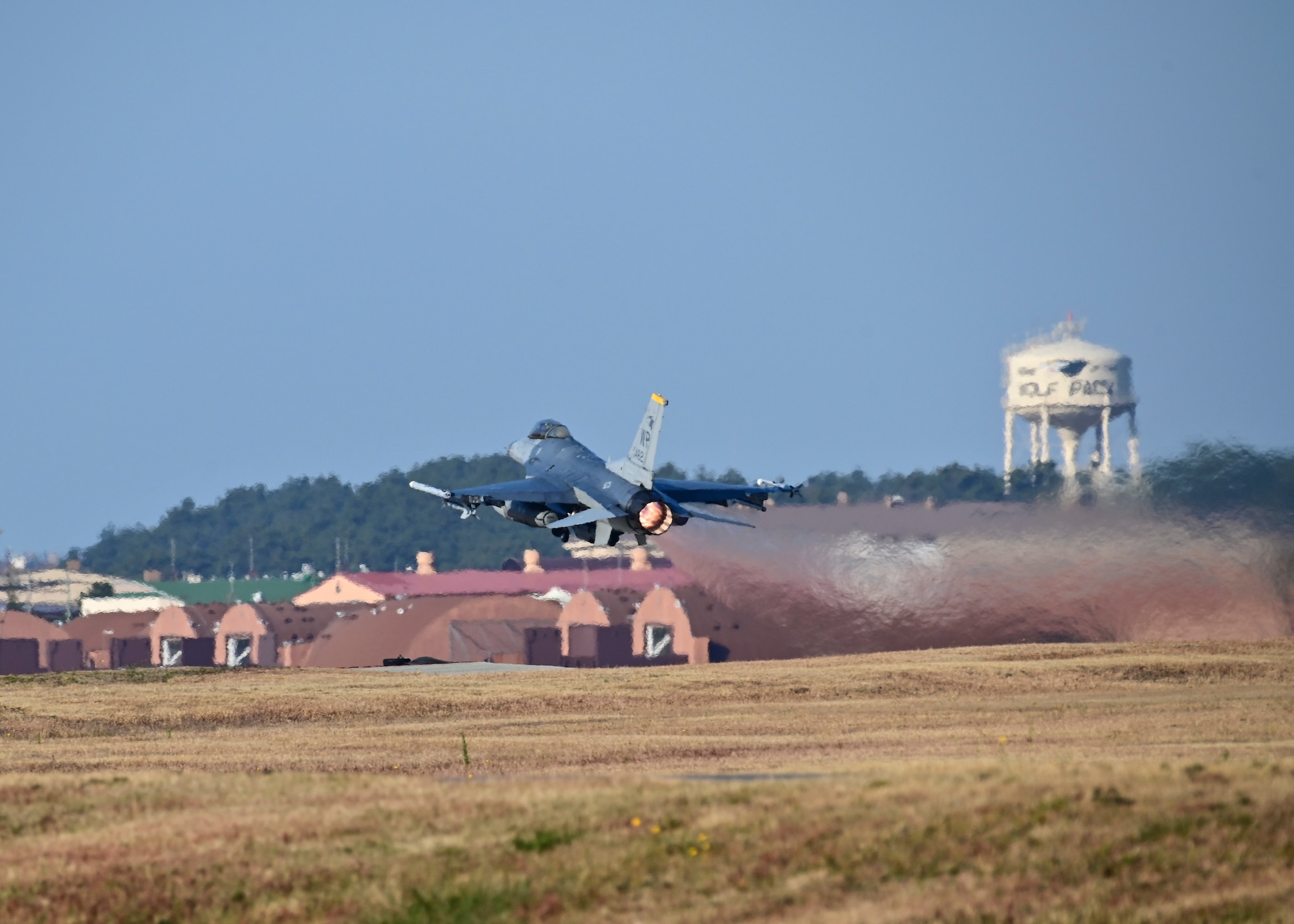 An F-16 Fighting Falcon assigned to the 80th Fighter Squadron flies over the flightline at Kunsan Air Base, Republic of Korea, Nov. 18, 2022. The 80th Fighter Squadrons executes air combat operations in support of U.S. and ROK interests in the Pacific area of responsibility. (U.S. Air Force photo by Staff Sgt. Isaiah J. Soliz)