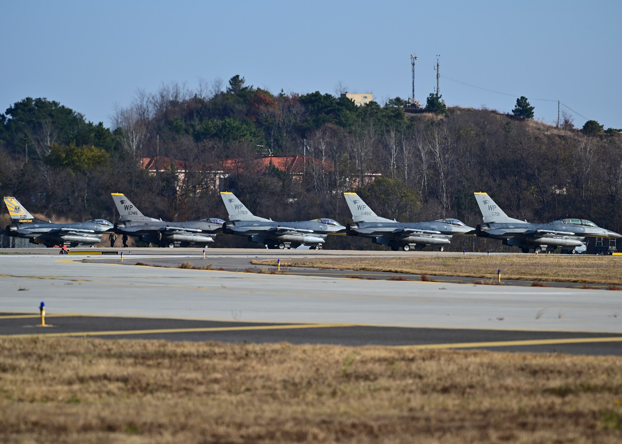 Five F-16 Fighting Falcons assigned to the 80th Fighter Squadron prepare to taxi during a training mission at Kunsan Air Base, Republic of Korea, Nov. 18, 2022. The 80th Fighter Squadrons executes air combat operations in support of U.S. and ROK interests in the Pacific area of responsibility. (U.S. Air Force photo by Staff Sgt. Isaiah J. Soliz)