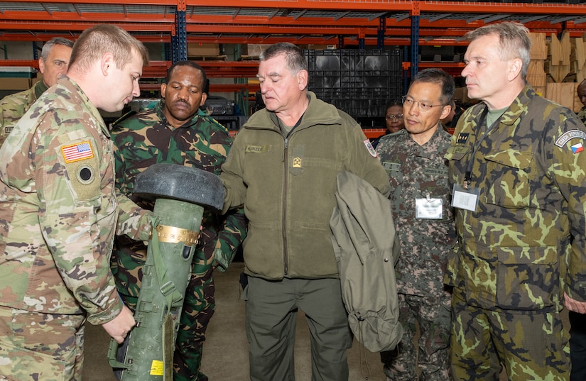 Capt. Kyle Lucken, training support officer, shows a group of foreign military officers a Javelin Missile simulator device at Fort Indiantown Gap’s Training Support Center Nov. 16 during Defense Intelligence Agency’s Fall 2022 Operations Orientation Program tour of Pennsylvania National Guard facilities here. (Pennsylvania National Guard photo by Wayne V. Hall)