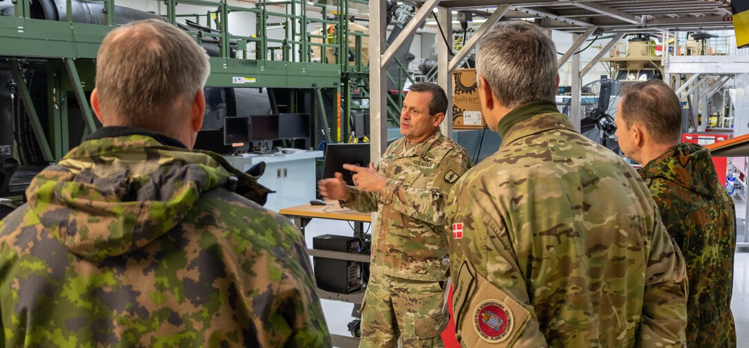 First Sgt. Steven Shirk, with the Eastern Army National Guard Aviation Training Site explains to a group of vising foreign military officers about the various types of aviation maintenance training conducted here Nov. 16 during Defense Intelligence Agency’s Fall 2022 Operations Orientation Program tour of Pennsylvania National Guard facilities here. (Pennsylvania National Guard photo by Wayne V. Hall)