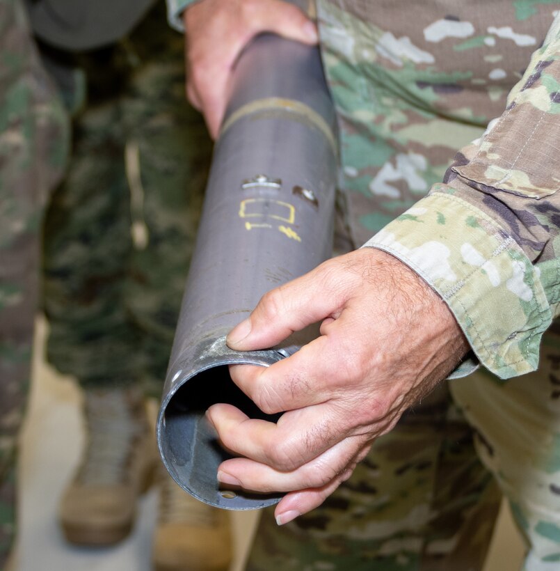 An instructor at the Eastern Army National Guard Aviation Training Site’s Aviation Maintenance Instructional Building here shows a group of visiting foreign military officers what saltwater corrosion on helicopter parts looks like Nov. 16 as part of the Defense Intelligence Agency’s Fall 2022 Operations Orientation Program tour of Pennsylvania National Guard facilities here.