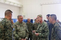 Navy Capt. Elizabeth Smith, right, commanding officer, Expeditionary Medical Facility (EMF) 150-Alpha, out of Camp Pendleton, California, briefs Air Force Lt. Gen. Ricky N. Rupp, center, commander, United States Forces, Japan, and Marine Corps Lt. Gen. James W. Bierman Jr., left, commanding general, III Marine Expeditionary Force, in the EMF at Camp Foster, Marine Corps Base S.D. Butler, Okinawa prefecture, Japan, during exercise Keen Sword 23, Nov. 15. Keen Sword is a joint, bilateral, biennial field-training exercise involving U.S. military and Japan Self-Defense Force personnel, designed to increase combat readiness and interoperability and strengthen the ironclad Japan-U.S. alliance. (Courtesy photo/Released)