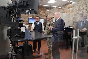 Air Force Research Laboratory, or AFRL, Commander Maj. Gen. Heather Pringle, left, surveys the newly-renovated Computed Tomography Laboratory, Nov. 9, 2022, at Wright-Patterson Air Force Base, Ohio, while John Brausch, center, Ryan Mooers and Steve Thompson, far right, welcome Pringle to the facility. The lab, part of AFRL’s Materials and Manufacturing Directorate, supports non-destructive testing of 3D-printed materials for the Department of Defense’s internal and external customer base. (U.S. Air Force photo / Jonathan Taulbee)