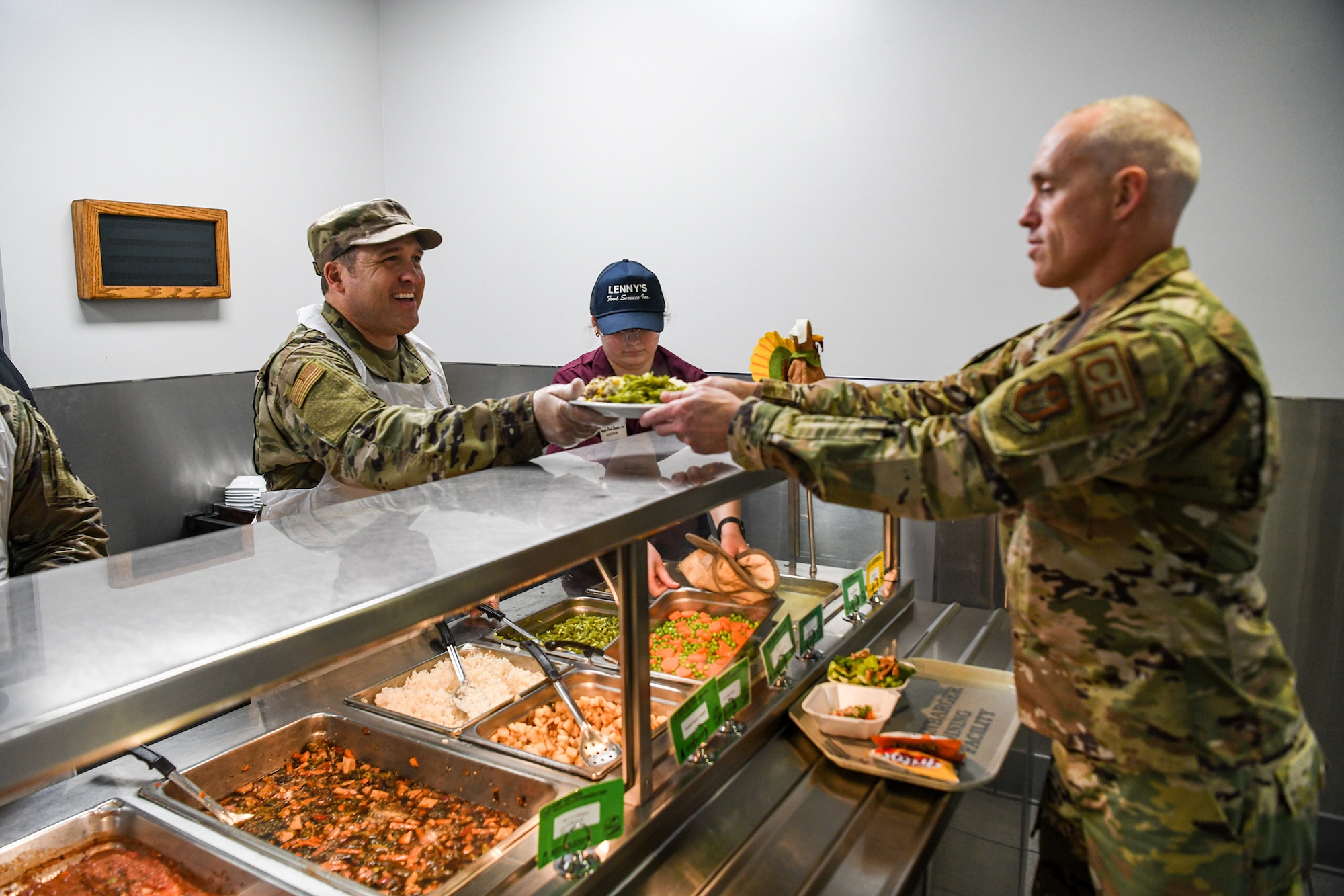 Chief Master Sgt. Brock Felgenhauer 445th Civil Engineer Squadron first sergeant, serves lunch to Airman at the Pitsenbarger Dining Facility, Wright-Patterson Air Force Base, Ohio, Nov 6, 2022. Commanders, first sergeants and chiefs serve Airmen at the dining facility during November unit training assemblies to show their appreciation for their service.