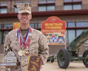 U.S. Marine Capt. Kyle King, the assistant operations officer with 3rd Battalion, 11th Marine Regiment, 1st Marine Division, poses for a photo with his awards from the 47th Annual Marine Corps Marathon at Marine Corps Air Ground Combat Center Twentynine Palms, California, Nov. 8, 2022. King is the first active-duty Marine to win the Marine Corps Marathon since 1983. The Marine Corps Marathon promotes physical fitness, generates community goodwill, and showcases the organizational skills of the Marine Corps.