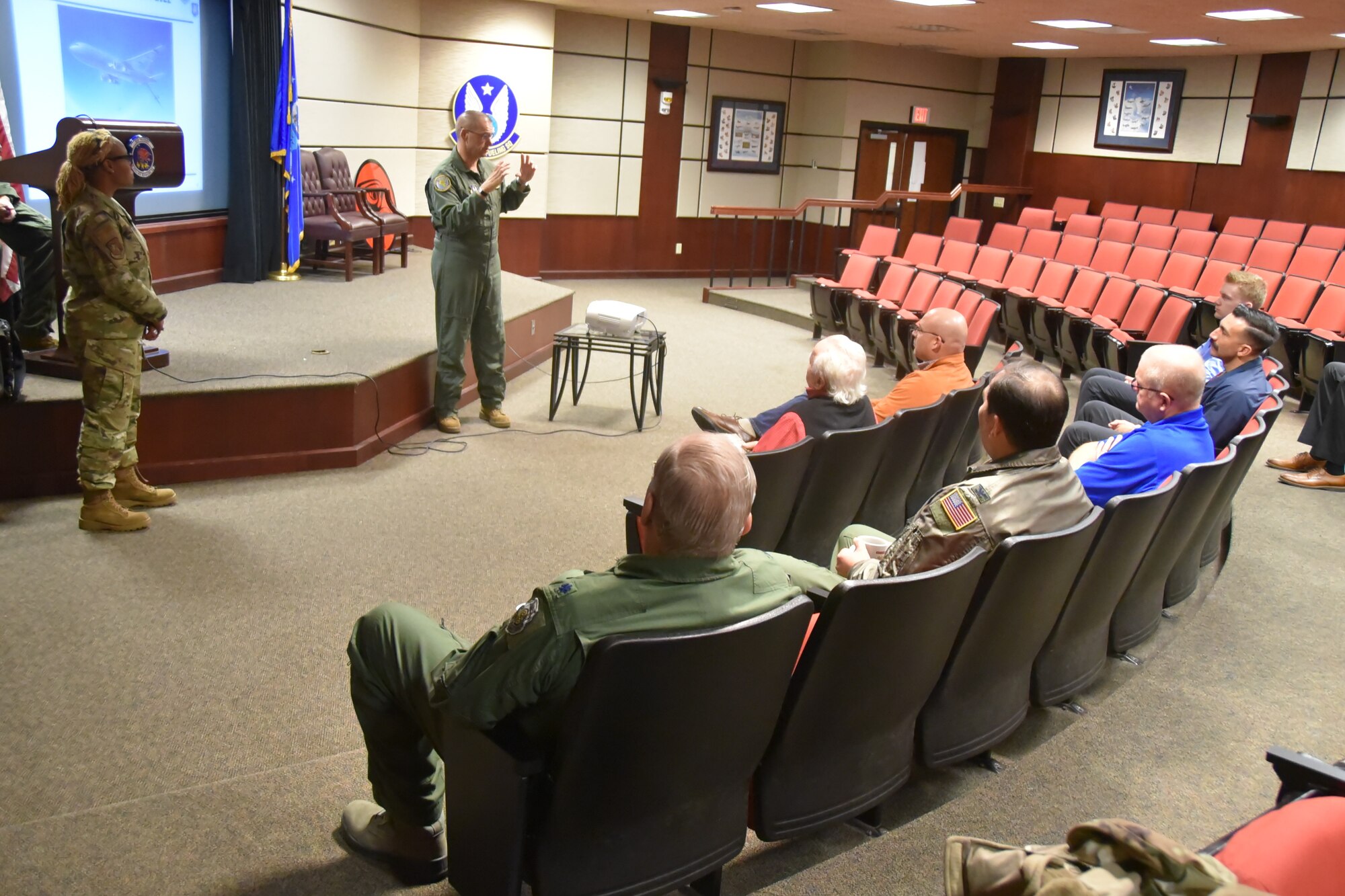 In a small squadron auditorium, Col. Phil Heseltine, 931st Air Refueling Wing commander, outline's McConnell's Reserve KC-46A Pegasus mission to 931st Air Refueling Wing civic leaders before a civic leader flight.