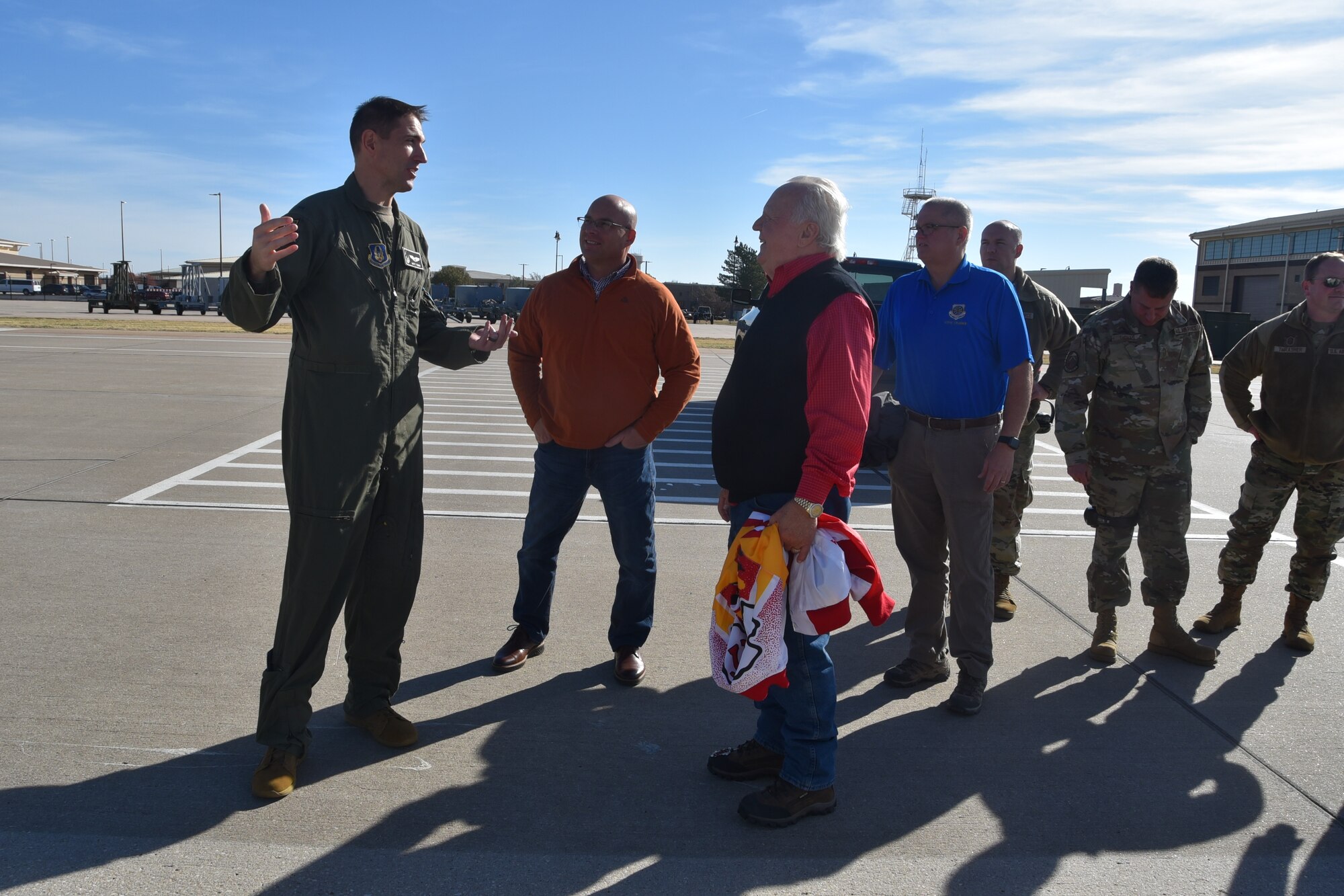 (Left to right ) Capt. Matt Tener, 905th Air Refueling Squadron pilot, discusses the features of the KC-46A 931st Air Refueling Wing civic leaders, before a civic leader flight outside on the flightline at McConnell.
