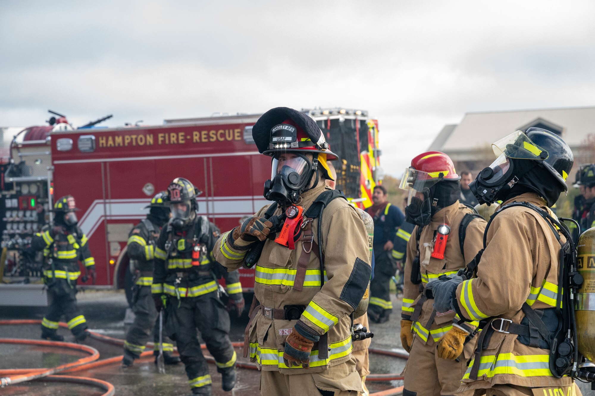 U.S. Air Force Staff Sgt. Jonathan Siebenaler, 633d Civil Engineer Squadron firefighter, stands by for a rapid intervention team work exercise in the burn building at Joint Base Langley-Eustis, Virginia, Nov. 17, 2022.