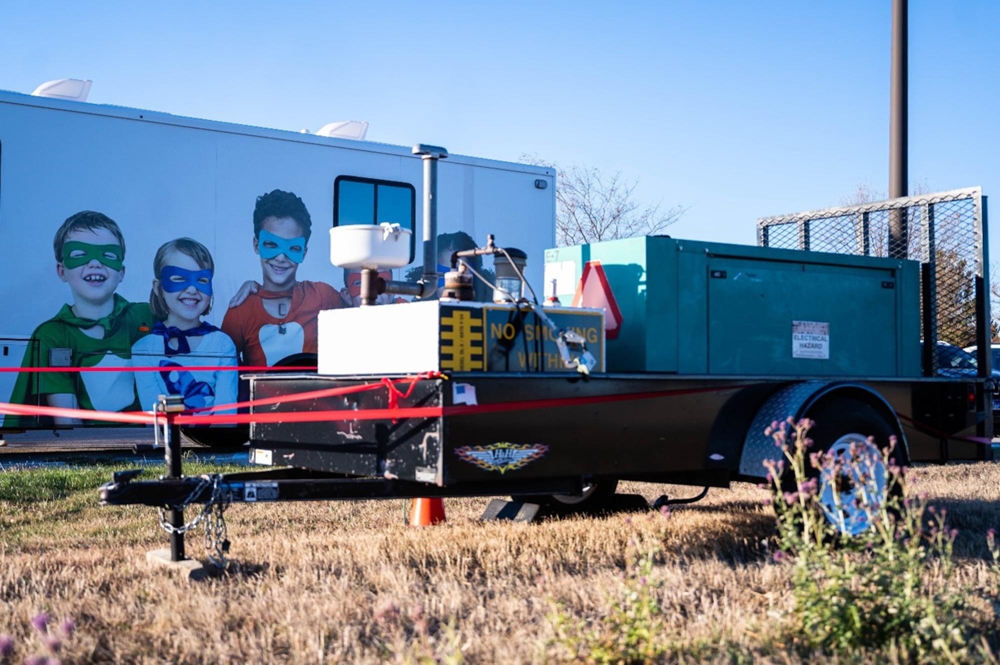 A generator belonging to the 28th Civil Engineer Squadron, sits outside a mobile dental truck providing free dental care to the children of Box Elder, S.D., Nov. 24, 2022.