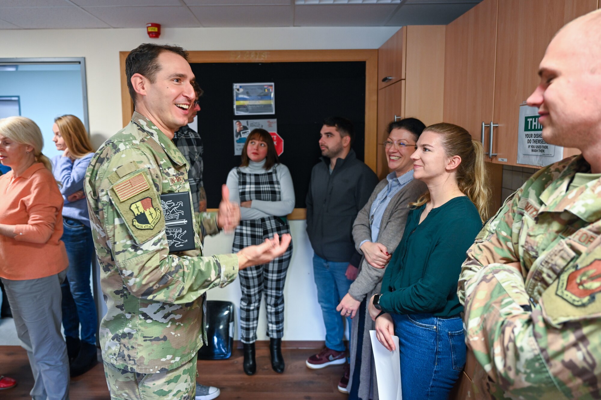 Chaplain (Capt.) Raidel Leon-Martinez, 52nd Fighter Wing, engages with members assigned to the 52nd Contracting Squadron at Spangdahlem Air Base, Germany, Nov. 10, 2022. The Chaplain Corps provides spiritual care and the opportunity for Air Force members and their families to exercise their constitutional right to the free exercise of religion. (U.S. Air Force photo by Senior Airman Jessica Sanchez-Chen)