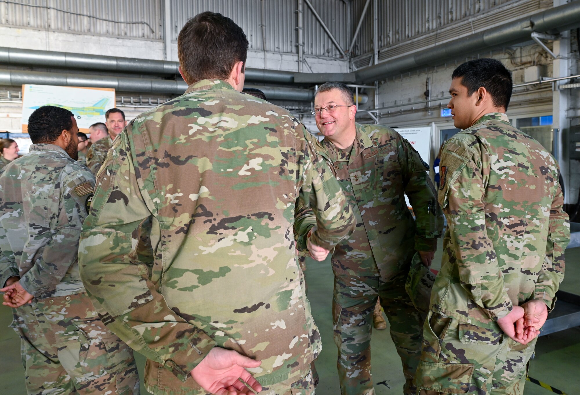 Chaplain (Maj. Gen.) Randall Kitchens, U.S. Air Force chief of chaplains, shakes hands with Airmen assigned to the 52nd Maintenance Group and 480th Fighter Squadron at Spangdahlem Air Base, Germany