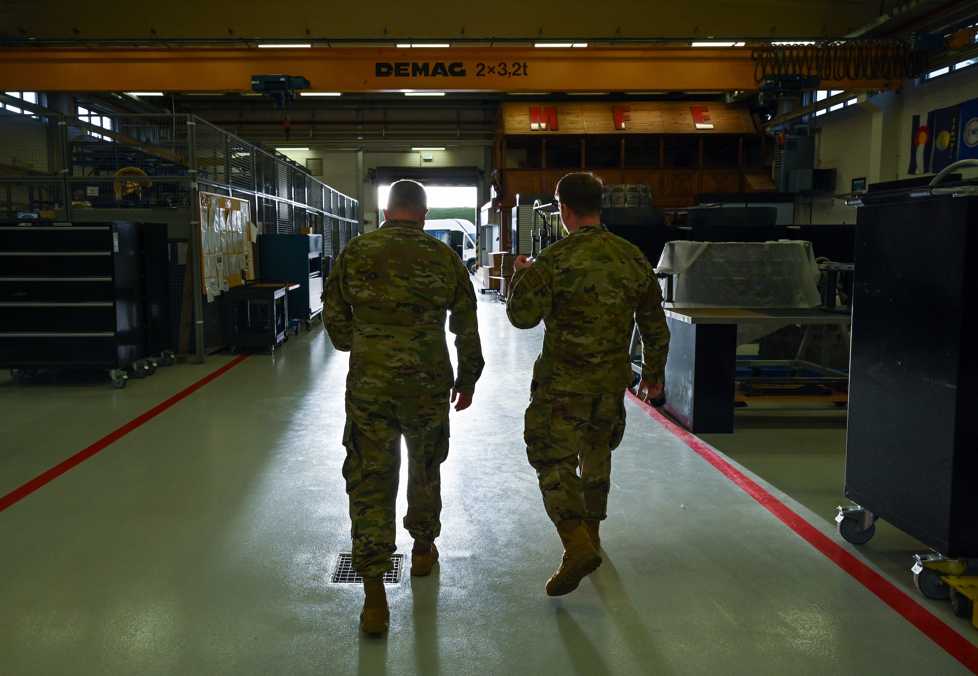 Chaplain (Maj. Gen.) Randall Kitchens, U.S. Air Force chief of chaplains, receives a tour of the Centralized Engine Repair Facility from Maj. Kevin Walton, 52nd Maintenance Squadron commander, at Spangdahlem Air Base, Germany.