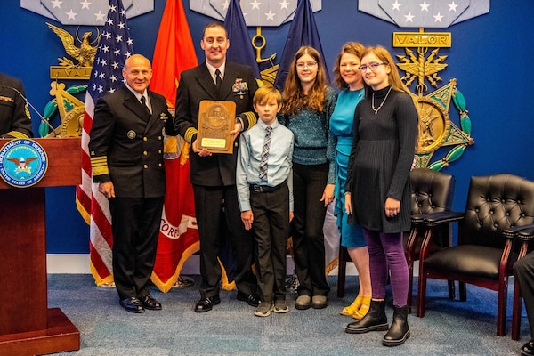 WASHINGTON (November 17, 2022) -  Chief of Naval Operations Adm. Mike Gilday presents Capt. Adam J. Thomas, former commanding officer, Ohio-class ballistic-missile submarine USS Alaska (SSBN 732) (Gold), with the 2022 Vice Admiral James Bond Stockdale Leadership Award during a ceremony held in the Hall of Heroes at the Pentagon, November 17, 2022. The Stockdale Leadership Award is presented annually to recognize commanding officers, one from the Pacific Fleet and one from the Atlantic Fleet, who demonstrate inspirational leadership, both professionally and personally, while also contributing to the improvement of leadership in the Navy. (U.S. Navy photo by Mass Communication Specialist 1st Class Michael B. Zingaro/released)