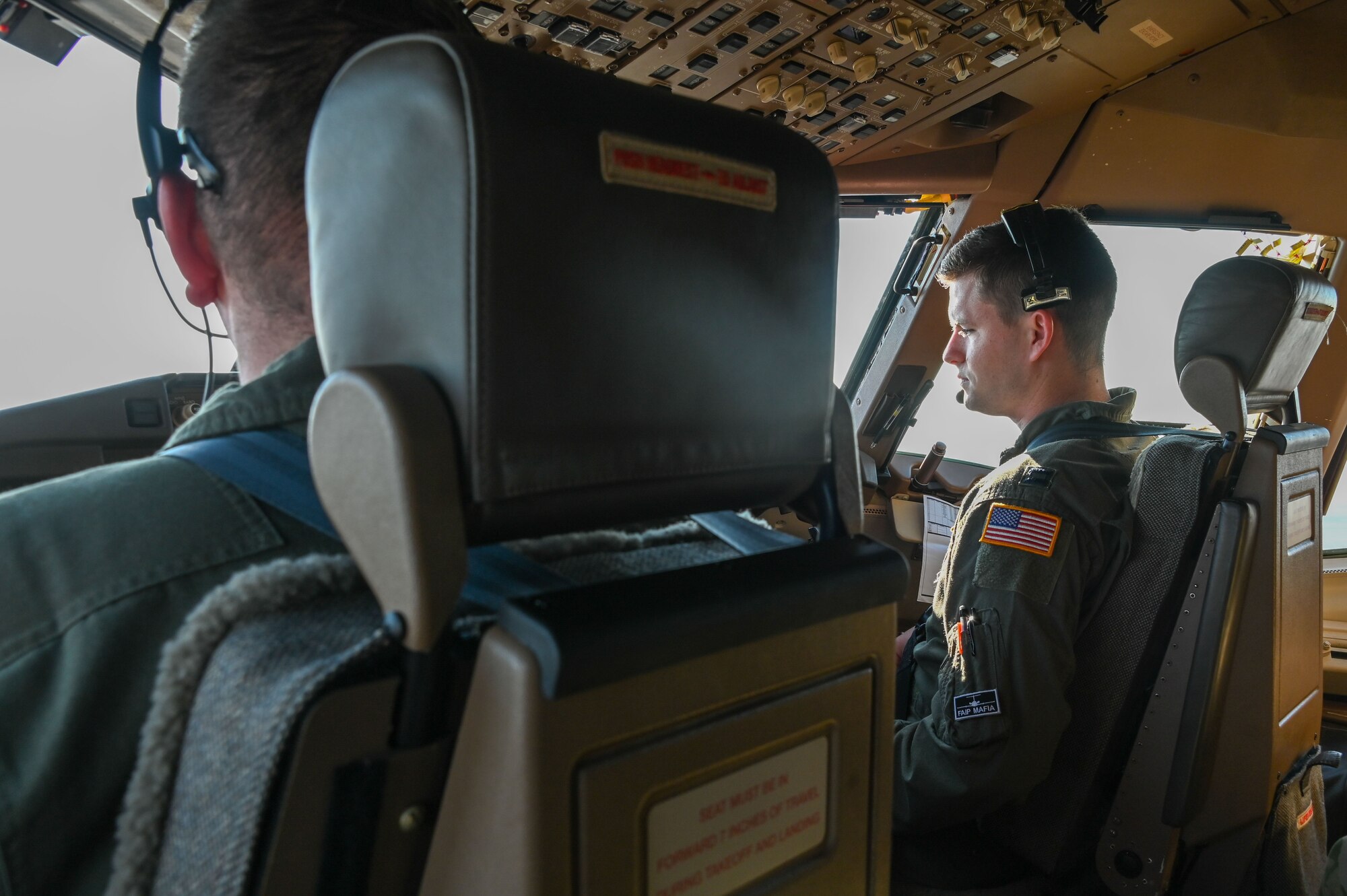 U.S. Air Force Capt. Brendan Bailey, 48th Flying Training Squadron instructor pilot, observes a “touch-and-go” procedure in the KC-46 Pegasus at Altus Air Force Base, Oklahoma, Nov. 16, 2022. Bailey was able to learn about the KC-46 capabilities including takeoff and landing and air fueling. (U.S. Air Force photo by Senior Airman Kayla Christenson)