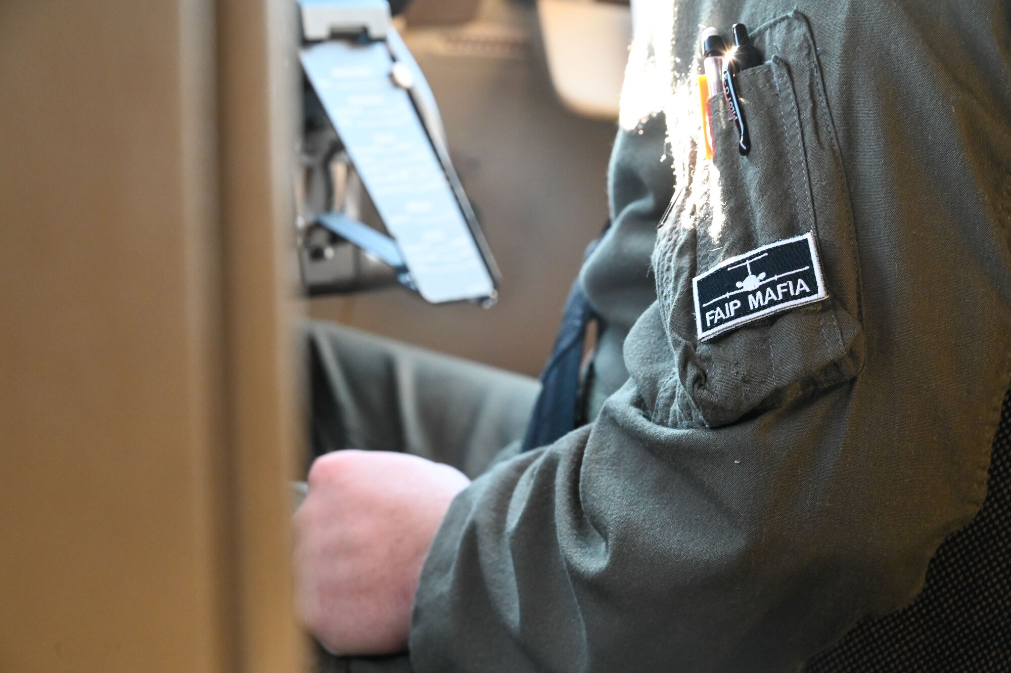 A patch with “FAIP Mafia'' is worn by a first assignment instructor pilot while watching air fueling on a KC-46 Pegasus in Nebraska airspace, Nov. 16, 2022. FAIPs are assigned at every undergraduate pilot training base, to teach the next generation of pilots. (U.S. Air Force photo by Senior Airman Kayla Christenson)
