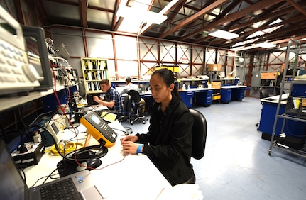 Biomedical equipment specialists at the U.S. Army Medical Materiel Agency’s Medical Maintenance Operations Division in Tracy, California, calibrate medical equipment in the special purpose Test, Measurement and Diagnostic Equipment, or TMDE, lab.