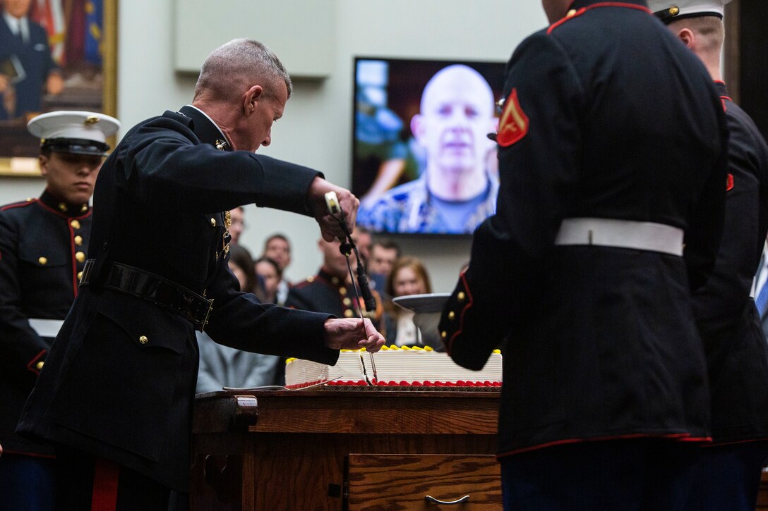 U.S. Marine Corps Gen. Eric Smith, the Assistant Commandant of the Marine Corps, cuts the ceremonial cake during the 247th U.S. Marine Corps birthday ceremony in Washington D.C., Nov. 15, 2022.  A cake cutting ceremony was held at the nation's Capitol in honor of the Marine Corps birthday and timeless traditions. In 1775 the Continental Congress was responsible for passing legislation establishing the Marine Corps as an official warfighting organization. (U.S. Marine Corps photo by Lance Cpl. Angel Alvarado)