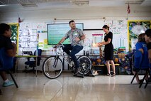 The Energy-Utility Branch at Marine Corps Base Hawaii conducts an experiment during an energy presentation at Mokapu Elementary School, MCBH, Nov. 10, 2022. The purpose of the presentation was to inform students on where energy comes from, energy conservation and the importance of protecting resources.