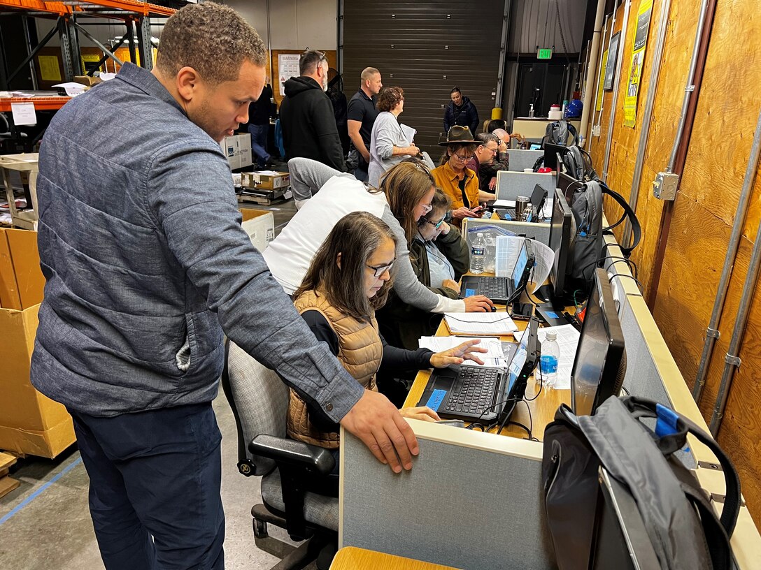 People working at laptop stations