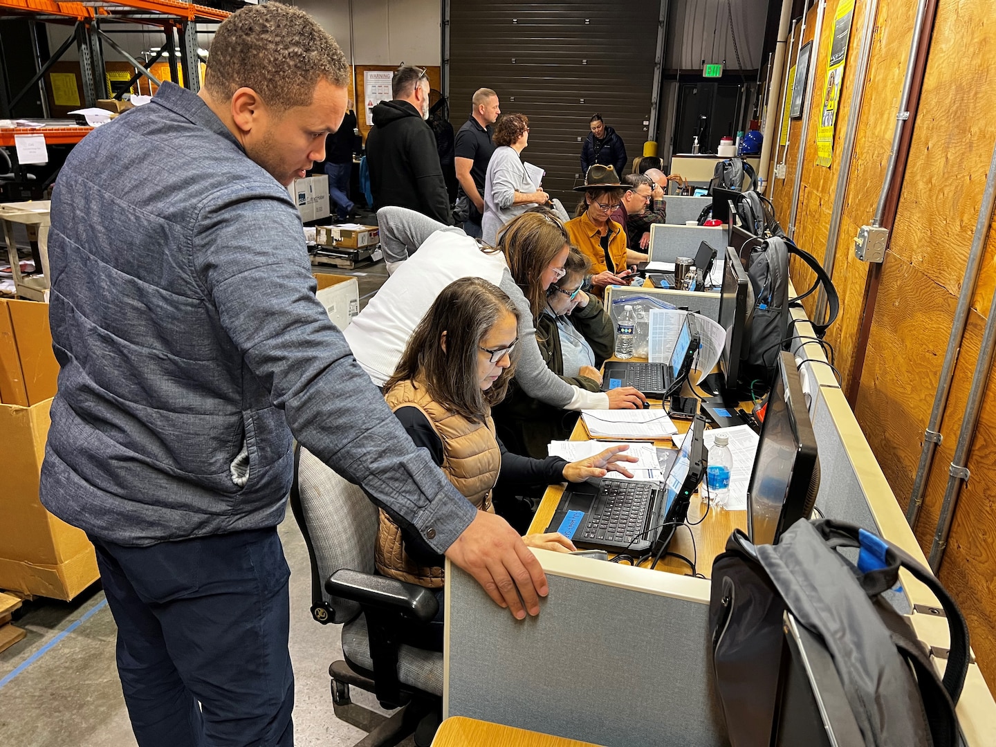 People working at laptop stations