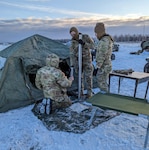 Airmen assigned to the 3rd Air Support Operations Squadron build a tent during an Arctic Familiarization field exercise at Eielson Air Force Base, Alaska, Oct. 26-28, 2022. The training included critical tasks like building an arctic tent, constructing an improvised shelter in the snow, maintaining firearms in a cold weather environment, and preventing cold weather injuries.