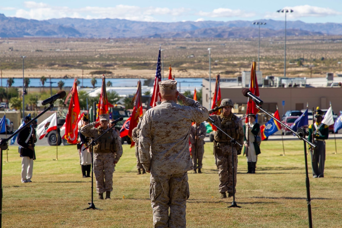 U.S. Marine Corps Maj. Gen. Austin Renforth, commanding general, Marine Air Ground Task Force Training Command, Marine Corps Air Ground Combat Center (MCAGCC), salutes the colors during the Marine Corps historical uniform pageant at MCAGCC, Twentynine Palms, California, Nov. 9, 2022. The event included a historical uniform pageant and the traditional cake cutting ceremony in honor of the 247th Marine Corps birthday. (U.S. Marine Corps photo by Lance Cpl. Jacquilyn Davis)