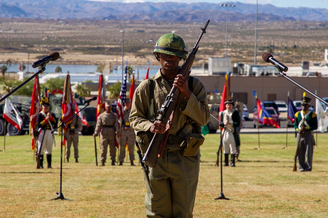 U.S. Marine Corps Lance Cpl. Dallas Burke, Headquarters Battalion, Marine Corps Air Ground Combat Center (MCAGCC), showcases a historic Marine Corps uniform during the Marine Corps historical uniform pageant at MCAGCC, Twentynine Palms, California, Nov. 9, 2022. The event included a historical uniform pageant and the traditional cake cutting ceremony in honor of the 247th Marine Corps birthday. (U.S. Marine Corps photo by Lance Cpl. Jacquilyn Davis)