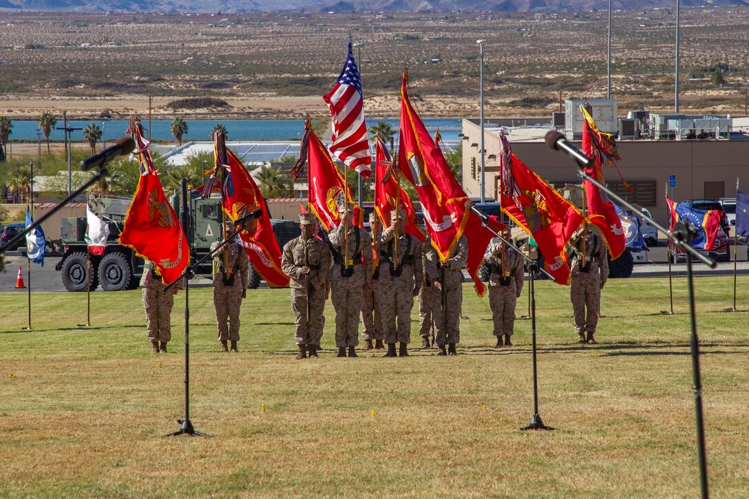 U.S. Marines with Marine Air Ground Task Force Training Command, Marine Corps Air Ground Combat Center (MCAGCC), present the colors during the Marine Corps historical uniform pageant at MCAGCC, Twentynine Palms, California, Nov. 9, 2022. The event included a historical uniform pageant and the traditional cake cutting ceremony in honor of the Marine Corps’ 247th birthday. (U.S. Marine Corps photo by Lance Cpl. Jacquilyn Davis)