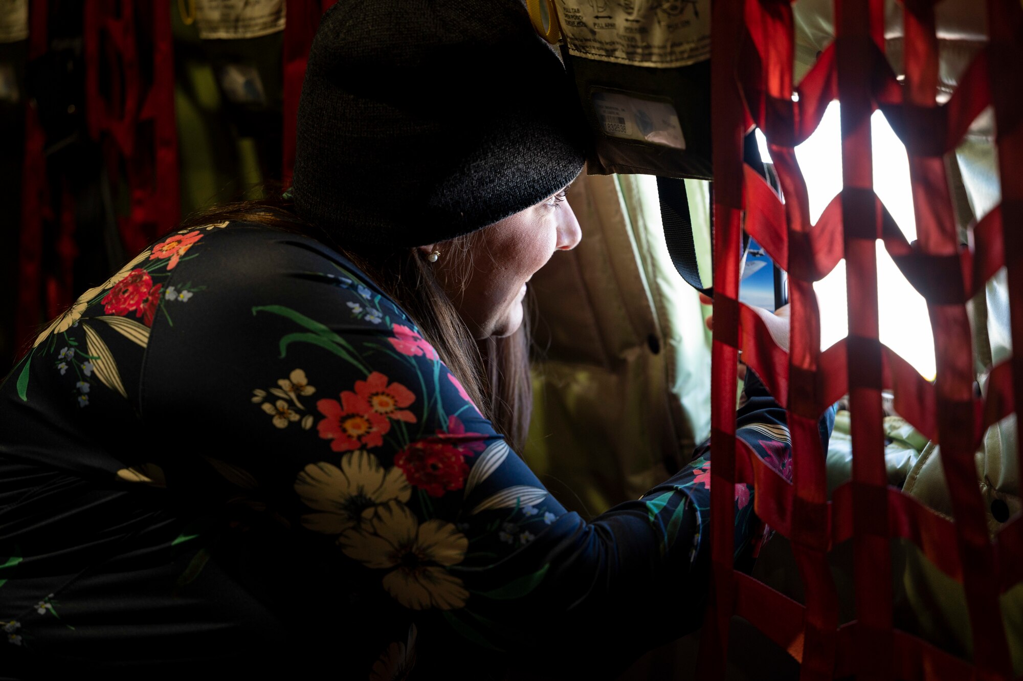 Nicole Neilson, a 49th Equipment Maintenance Squadron spouse, photographs an aircraft while inside a KC-135 Stratotanker from the 121st Air Refueling Wing at Rickenbacker Air National Guard Base, Columbus, Ohio, Nov. 15, 2022.