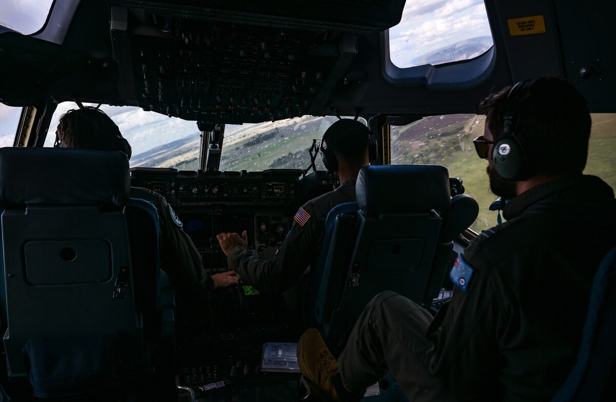 Royal Australian Air Force Flight Lt. Lukas Wijacha, No. 36 Squadron C-17 Globemaster III pilot, and 1st Lt. Marcus Pryor, 535th Airlift Squadron C-17 co-pilot, fly at low levels in a two-ship formation during Exercise Global Dexterity in the skies over Queensland, Nov. 14, 2022. Exercise Global Dexterity 2022 is being conducted at RAAF Base Amberley, and is designed to help develop the bilateral tactical airlift and airdrop capabilities of the United States Air Force (USAF) and the Royal Australian Air Force (RAAF). Both the United States and Australia rely on the C-17A to provide strategic and tactical airlift across the Indo-Pacific region, with its ability to provide short-notice and time-critical airlift support making it essential during humanitarian assistance and disaster relief operations. (U.S. Air Force photo by Staff Sgt. Alan Ricker)