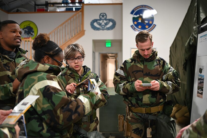 People dressed in chemical protective gear