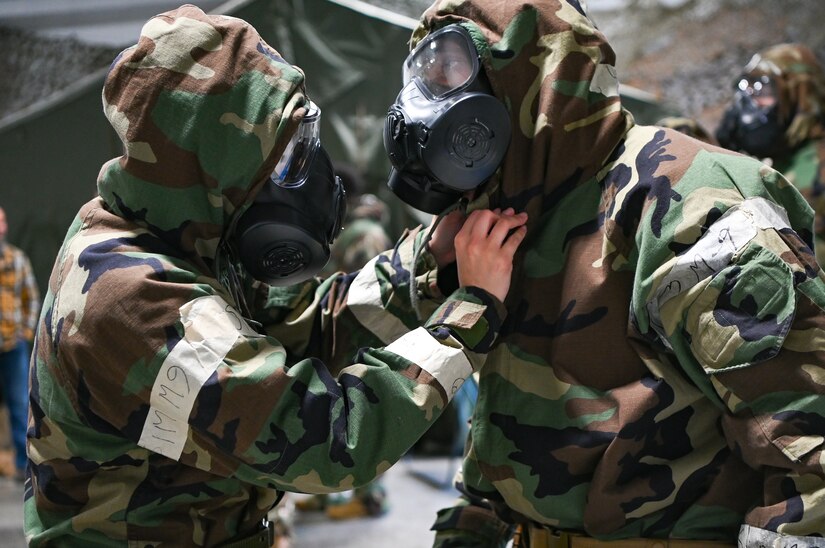 People dressed in chemical protective gear