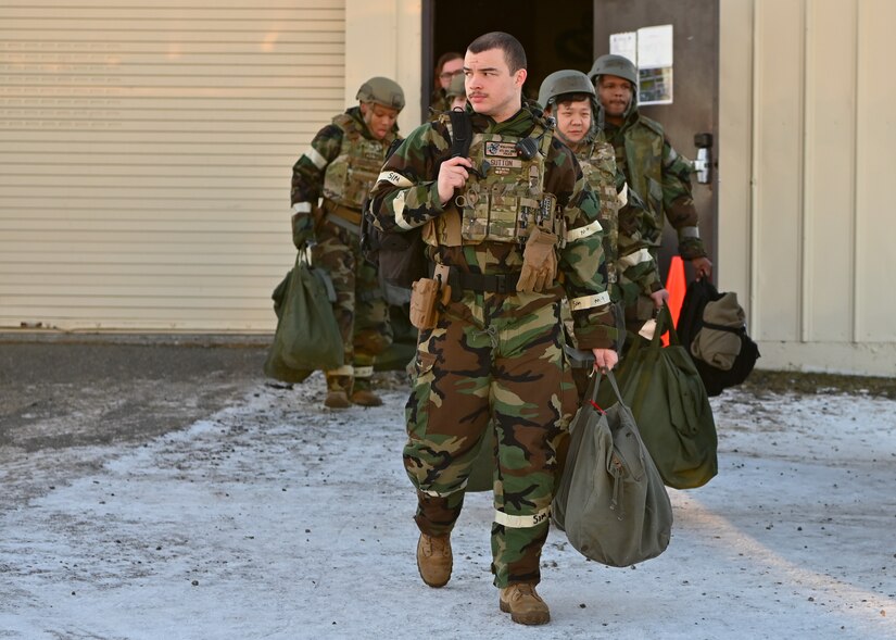 People dressed in chemical protective gear