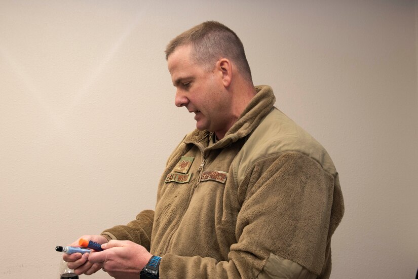 Matthew Eastwood showing a training aid
