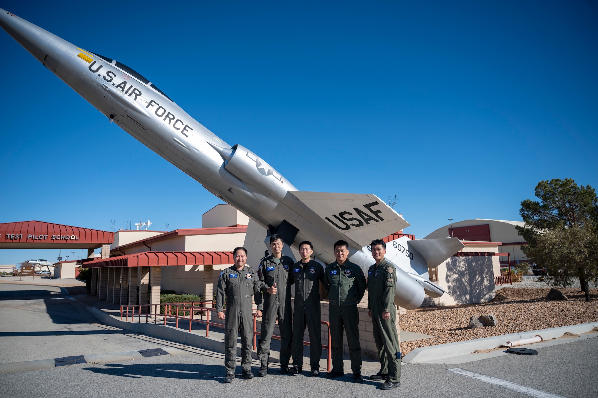 The USAF Test Pilot School (TPS) at Edwards Air Force Base hosted the Republic of Korean Air Force (ROKAF) for a technical exchange, sharing both flight experiences and cultural traditions. The goal is to make the (TPS) students more well-rounded flight test professionals by exposure to different aircraft, control rooms, test centers, and test facilities.