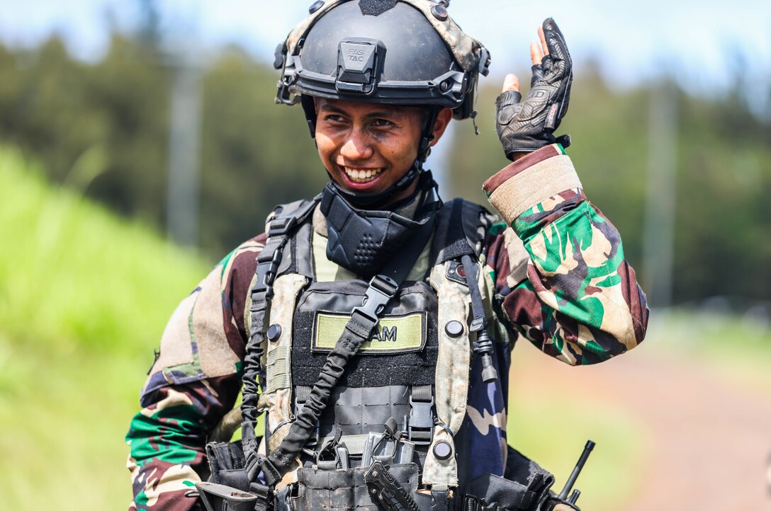 A Soldier from the Indonesian National Army smiles after the Joint Pacific Multi-National Readiness Center rotation 22-01 exercise on Kahuku Training Area, Hawaii on Oct. 25, 2021. JPMRC Rotation 22-01 provides the 25th Infantry Division the opportunity to integrate and train alongside our partners and allies throughout the Indo-Pacific Region. (U.S. Army photo by Sgt. Carlie Lopez/28th Public Affairs Detachment)