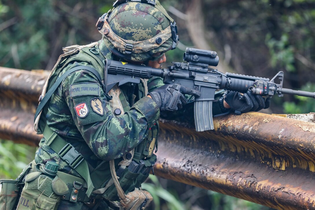 A Soldier from the Royal Thai Army pulls security during the Joint Pacific Multi-National Readiness Center rotation 22-01 exercise on Kahuku Training Area on Oct. 25, 2021. JPMRC Rotation 22-01 provides the 25th Infantry Division the opportunity to integrate and train alongside our partners and allies throughout the Indo-Pacific Region. (U.S. Army photo by Sgt. Carlie Lopez/28th Public Affairs Detachment)