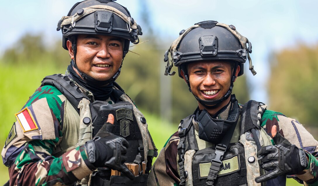 Soldiers from the Indonesian National Army smile after the Joint Pacific Multi-National Readiness Center rotation 22-01 exercise on Kahuku Training Area, Hawaii on Oct. 25, 2021. JPMRC Rotation 22-01 provides the 25th Infantry Division the opportunity to integrate and train alongside our partners and allies throughout the Indo-Pacific Region. (U.S. Army photo by Sgt. Carlie Lopez/28th Public Affairs Detachment)